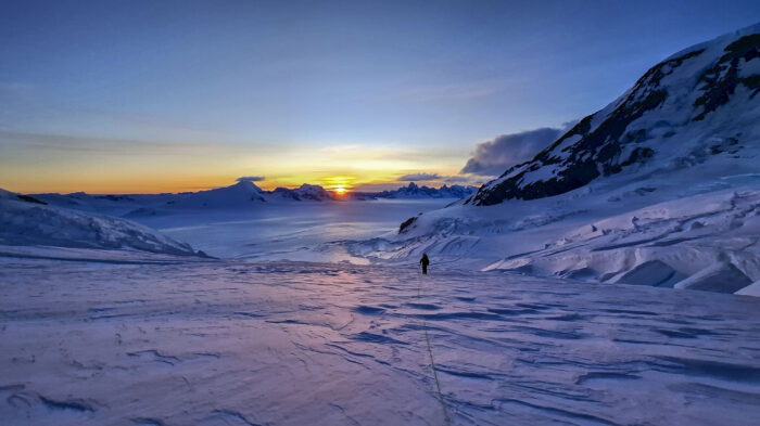 A skier on the Patagonian Southern Icefield at sunset.