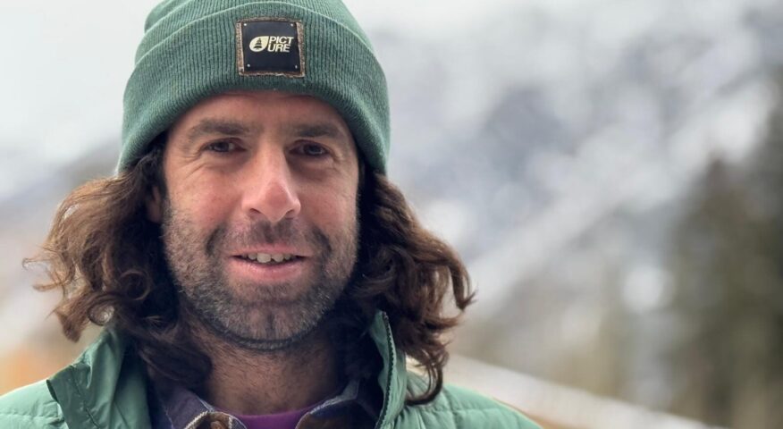 Close shot of Elias Millerioux in Banff wearing a green beanie.