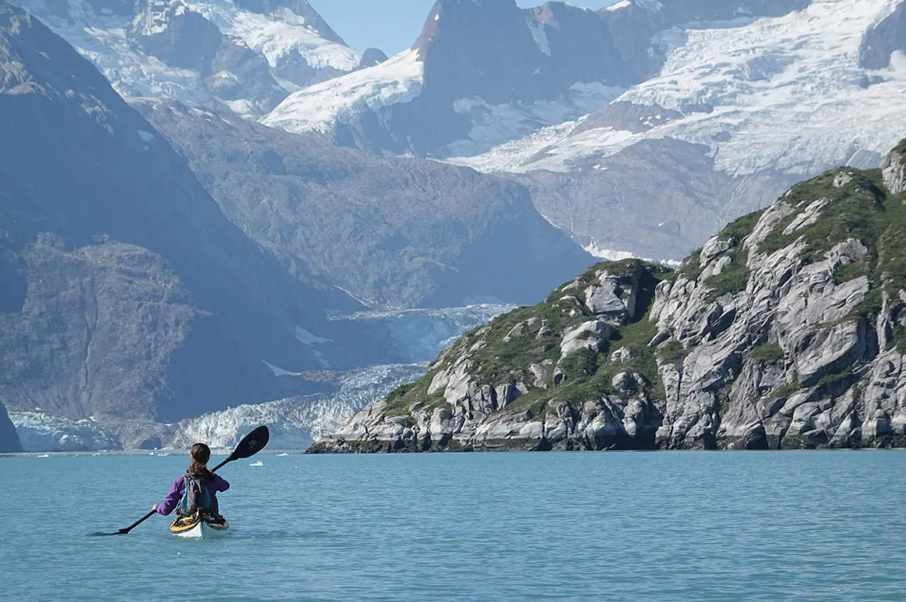 kayaker in mountainous scenery