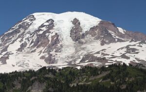A snow capped purple mountain