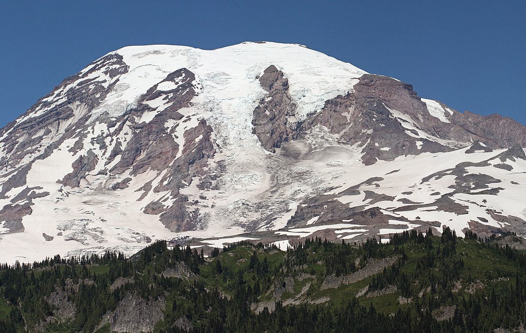 A snow capped purple mountain