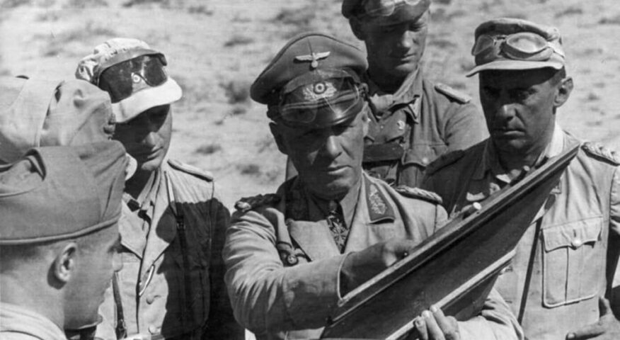 General Rommel looking at a map with others