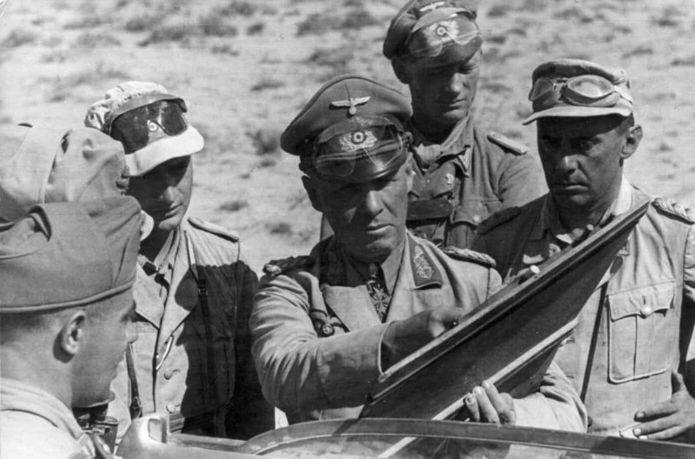 General Rommel looking at a map with others