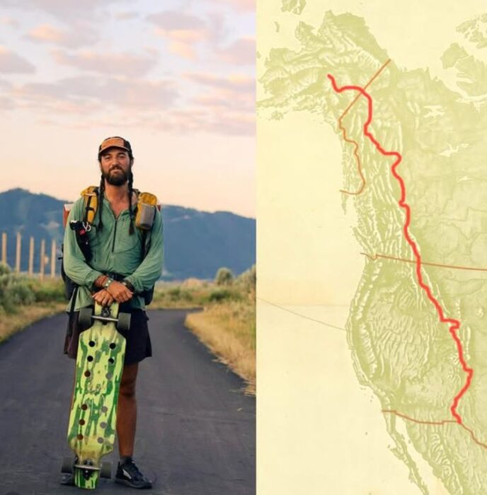 skateboarder standing beside route map