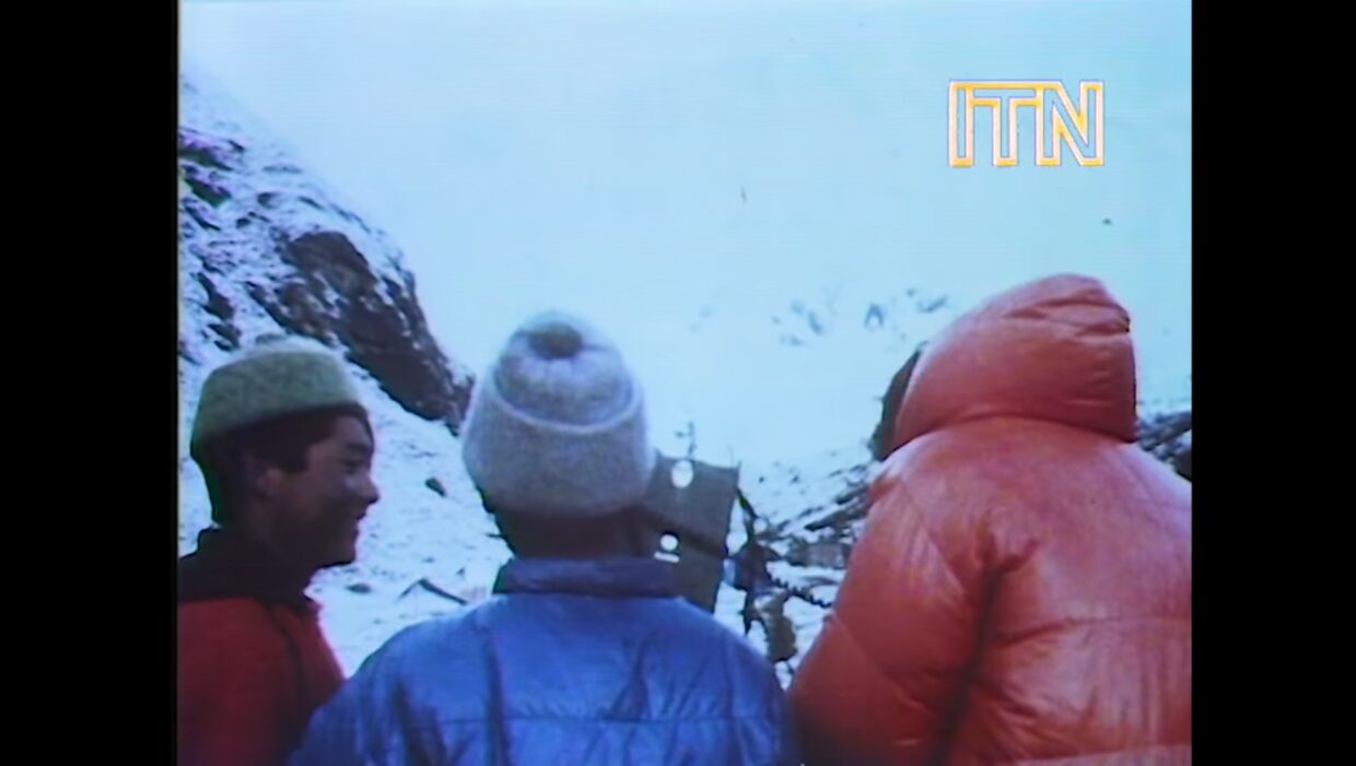 people gathered around a radio