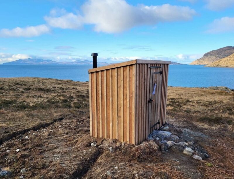 outhouse overlooking lake