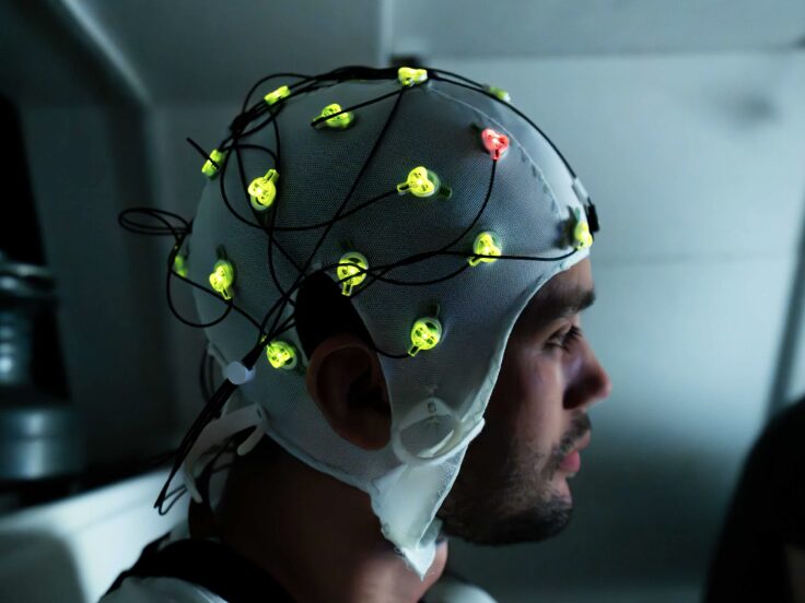 Research participant wearing a cap to monitor brain activity