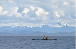 kayaker and mountains