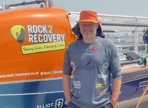 Dave 'Dinger' Bell stands infront of his boat before starting his row across the Pacific and Indian Oceans