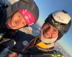 Close shot of Ines Papert and Simon Gietl in climbing geat and helmets.