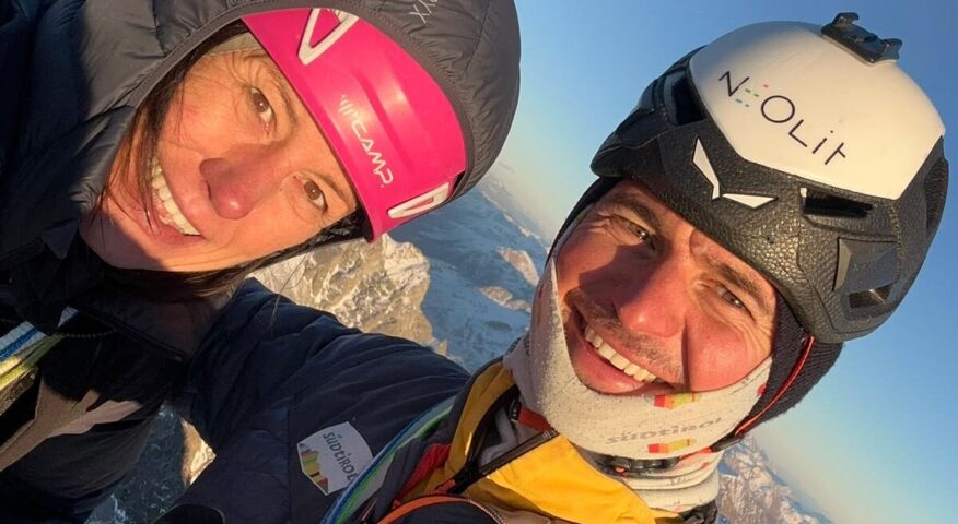 Close shot of Ines Papert and Simon Gietl in climbing geat and helmets.