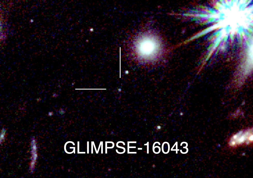 A tiny dot next to larger galaxies.