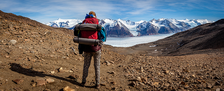 woman hiker atop mountain pass