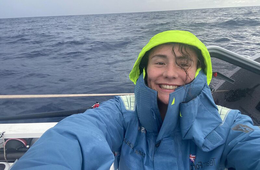 smiling woman rowing