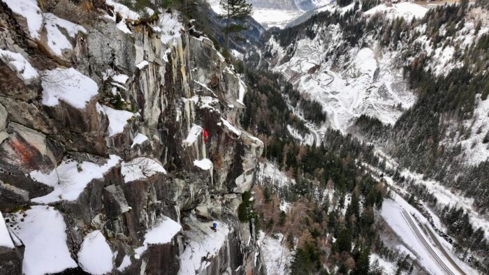 Climbers on a snowed up granite face. 