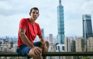 Alex Honnold in taiwan with the Taipei 101 building in background.