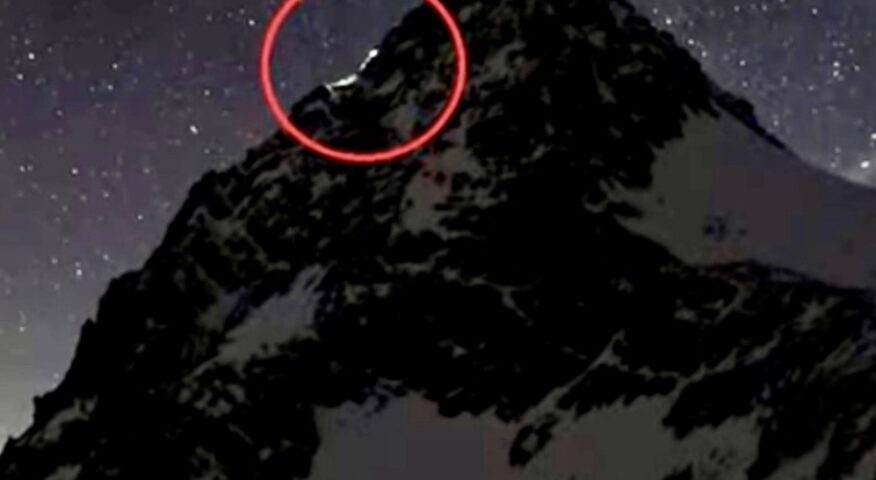 A webcam was recording during the night on Grossglockner. The couple's headlamps are circled in red.
