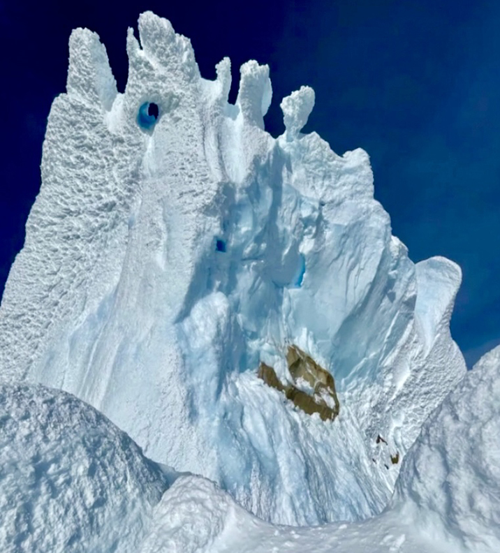 Looking up the last pitch of Cerro Torre from the penultimate pitch. The serac scar is clearly visible, and the false tunnel is the hole a bit to the right of the central arete.