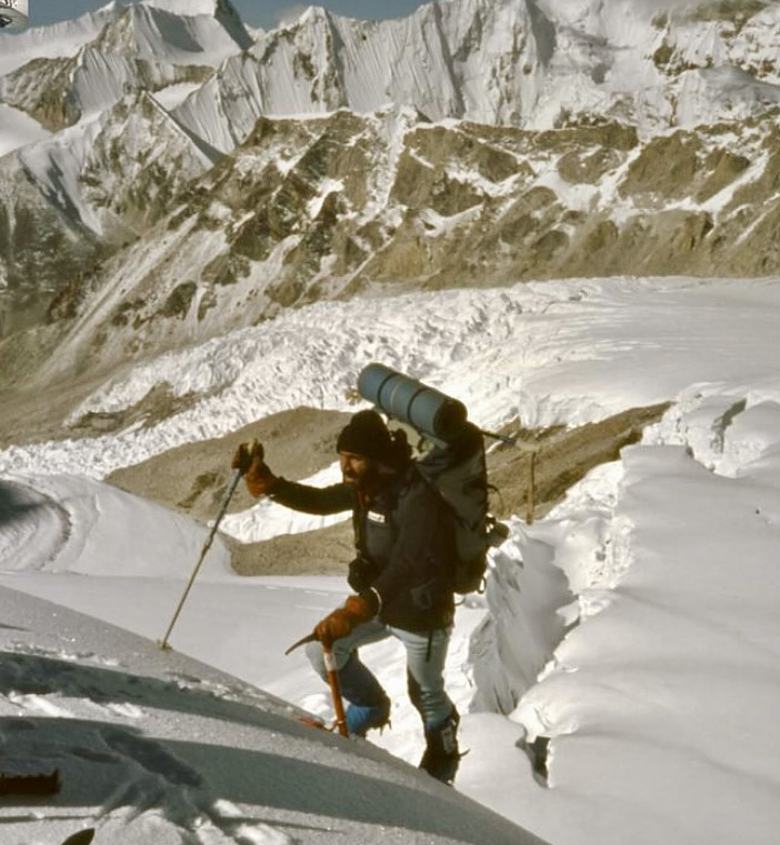 man walking up steep slope