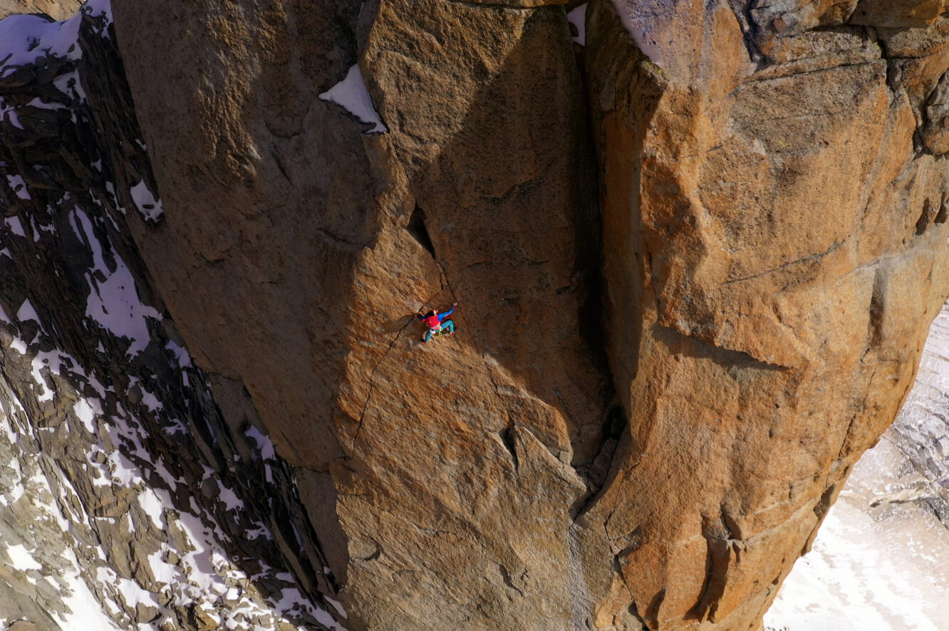 small figure on alpine wall