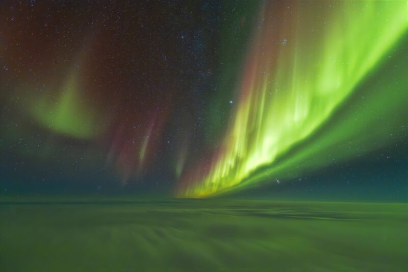 An aurora image taken by a pilot as he flies over Hudson Bay