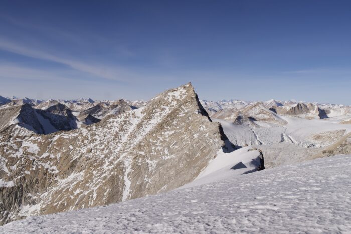Mostly dry peaks on a clear day.