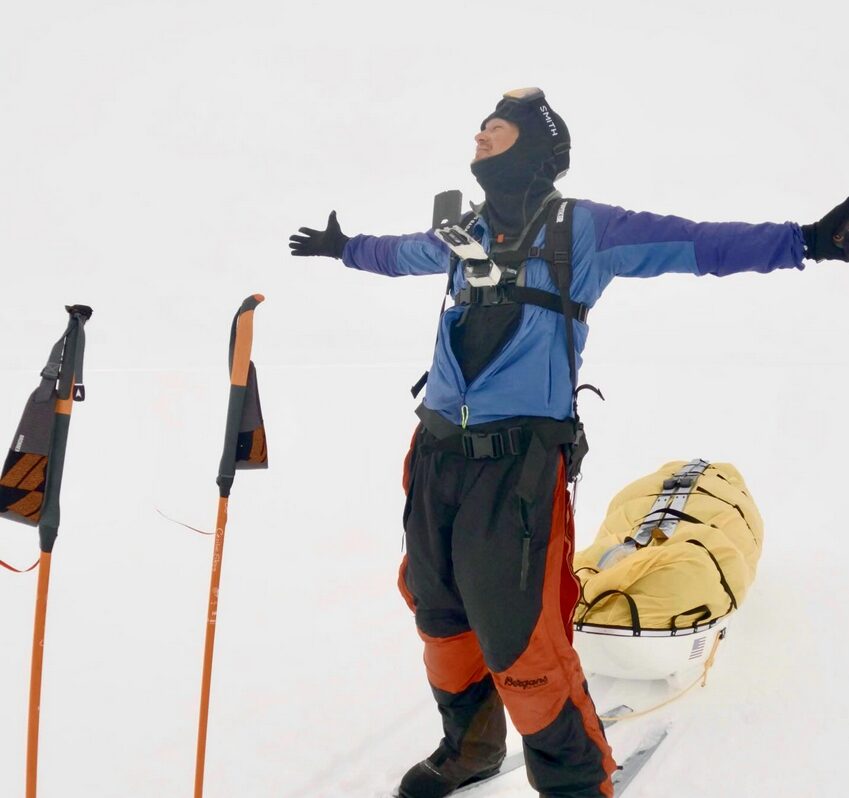 A man with polar gear in the snow