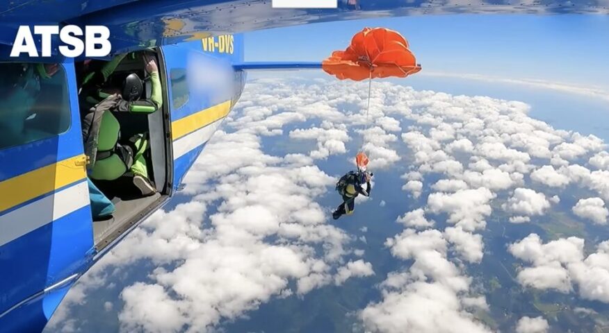 skydiver's parachute snagged on tail of plane