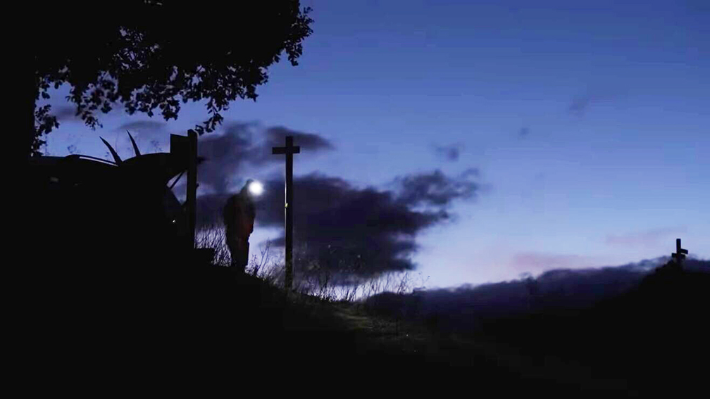 man with headlamp at night