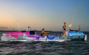 two women in an ocean rowboat