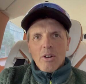 Close shot of Simone Moro speaking in a car.