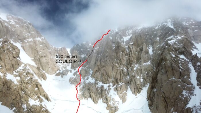 A route marked in red on a photo of Tirich Mir. 