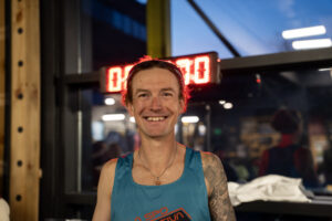 Close shot of Tyler Andrews in a running t-shirt.