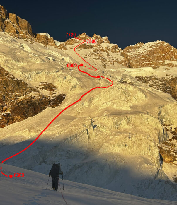 A climber on a glacier with the route marked in red. 