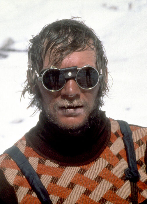 Close shot of Jerzy Kukuczka with round glacier sunglasses.
