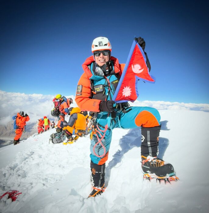 A Nepalese climber on the summit of Pakistan's K2.