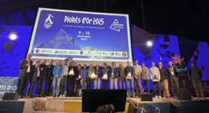 Awarded climbers in line on stage.