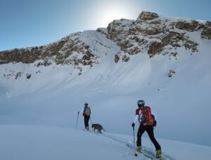 Skiers in the Pyrenees, approaching a peak.