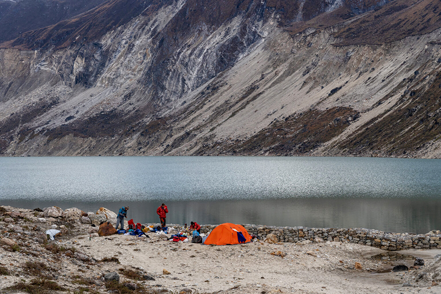 A tent by a lake.