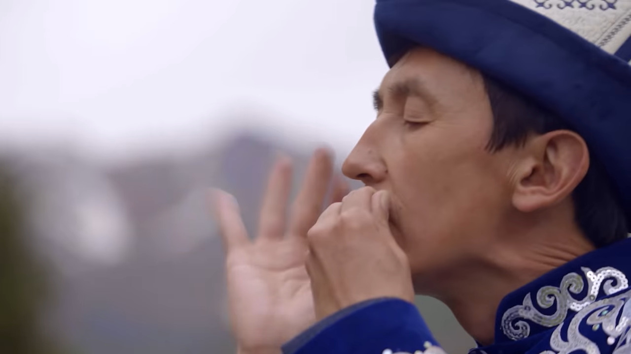 A man playing the mouth harp