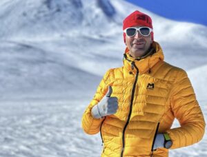 Close shot of Iranian climber A. Gozali with a snowy background.