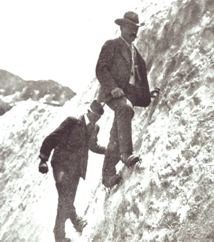 two 19th century climbers in suits