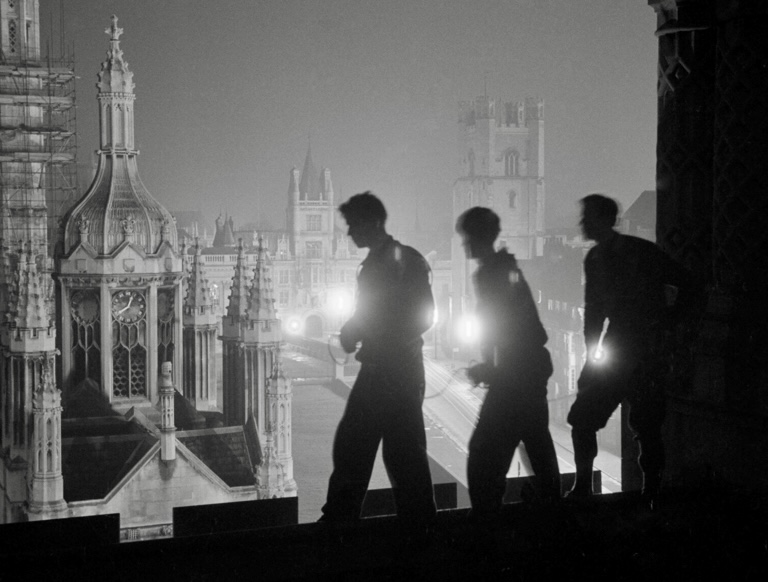 Night climbing on the roof of one of Cambridge University's histpric buildings, 1959.