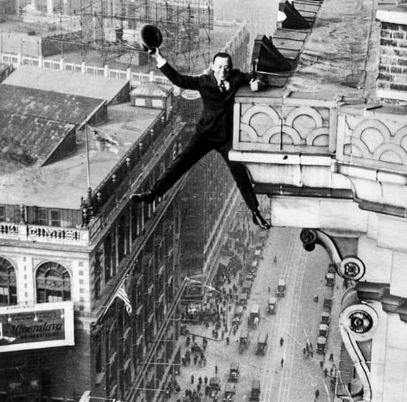 Human Fly Harry Gardiner hanging from the 22nd floor of Hotel McAlpin on Broadway in 1922.