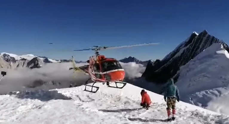 Frame of a video showing a helicopter taking off from Manaslu's Camp 1.