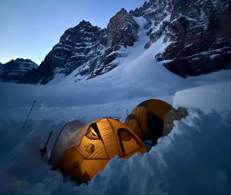 tents at night at foot of mountain