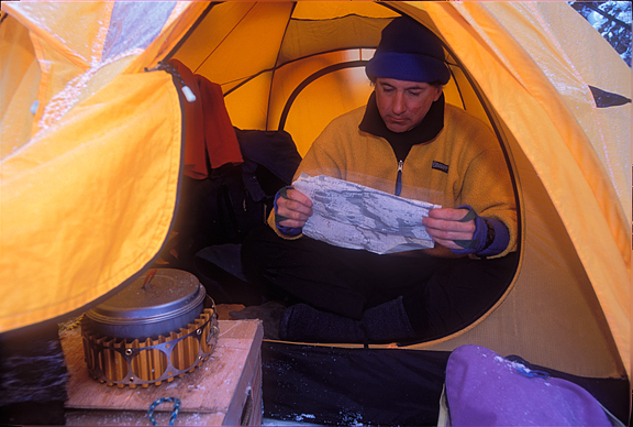 reading map in tent