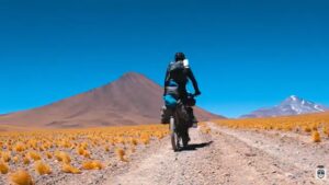 A bike amid mountain grasses.