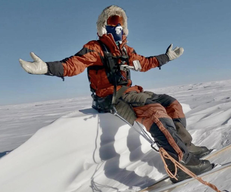 Colin O'Brady takes a break on a convenient sastrugi wave.