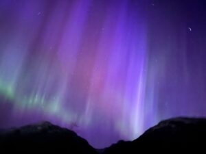 Purple, red and green aurora displays seen in the sky over Canada because of the solar storms